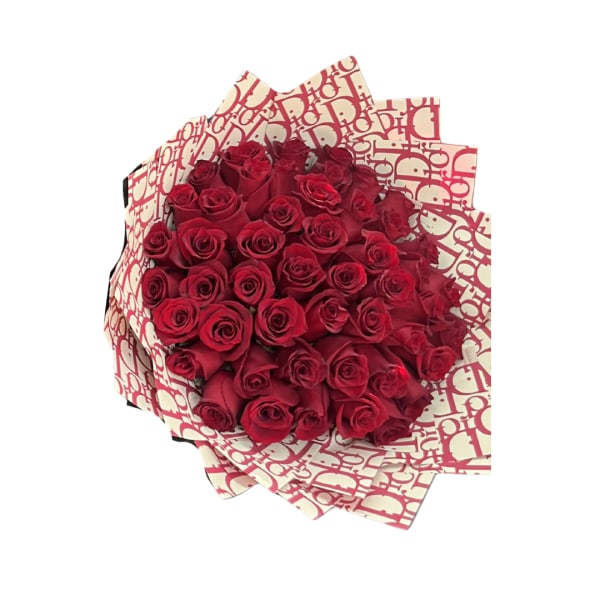 Bouquet of red roses wrapped in patterned paper