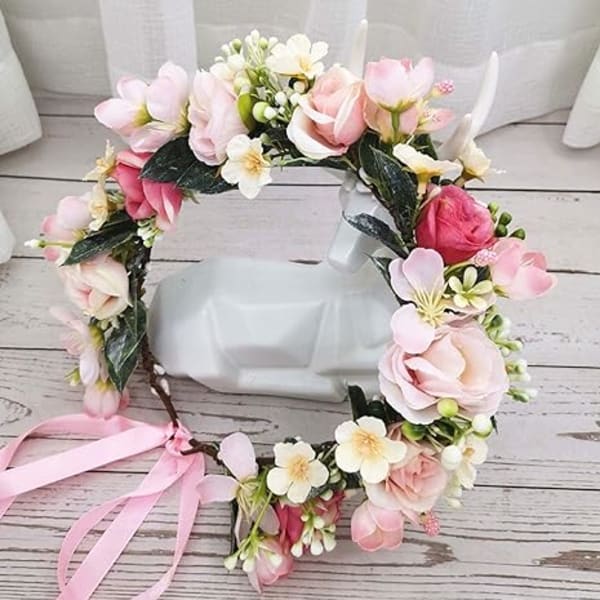 Floral wreath with pink and white blossoms and a pink ribbon