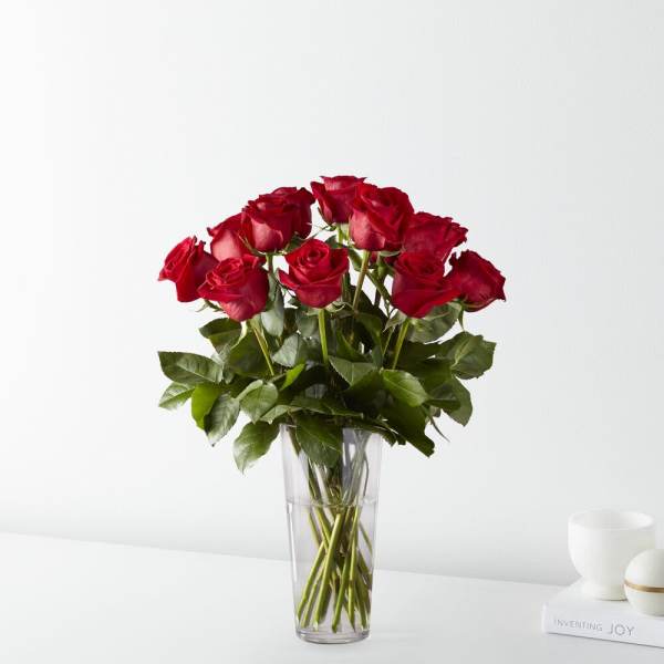 Red roses in a clear glass vase