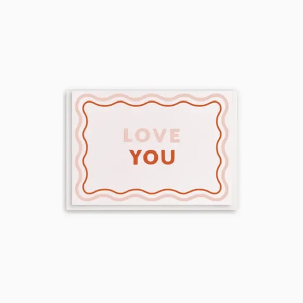 Greeting card with the words "LOVE YOU" in pink and orange