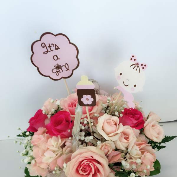 Pink and cream rose bouquet with baby’s breath and cute topper signs