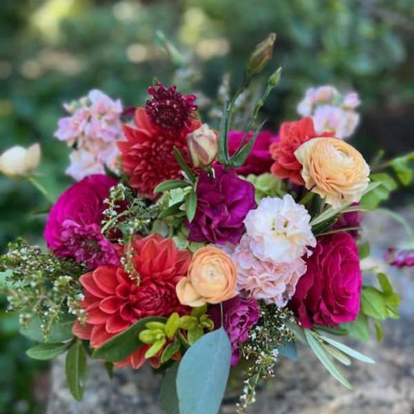 Mixed bouquet of pink, coral, and cream flowers