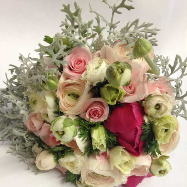 Bouquet of pale pink and cream flowers with silvery foliage