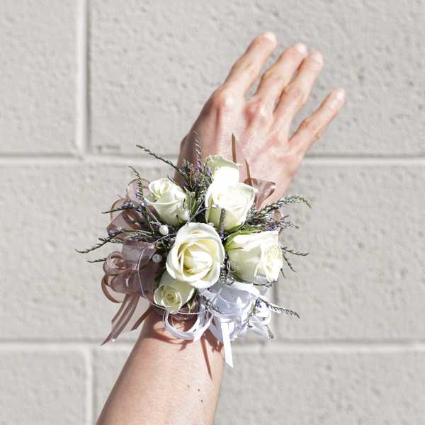 White rose wrist corsage with ribbon accents