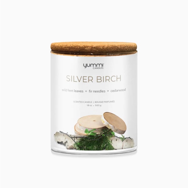 Scented candle in a glass jar with a wooden lid