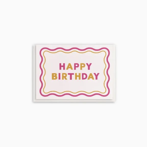 Birthday card with pink and gold lettering and a wavy border