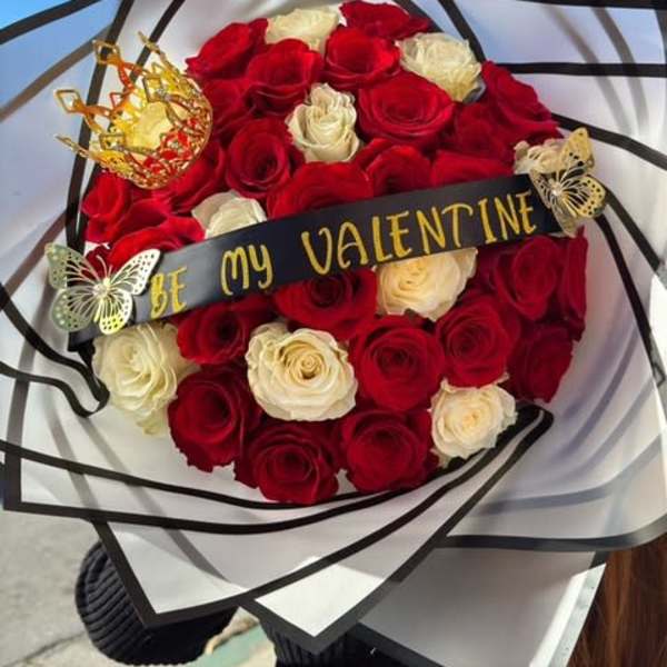 Bouquet of red and white roses with a "Be My Valentine" ribbon