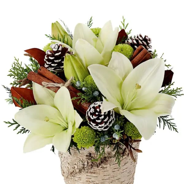 White lilies in a birch bark pot with pinecones and cinnamon sticks