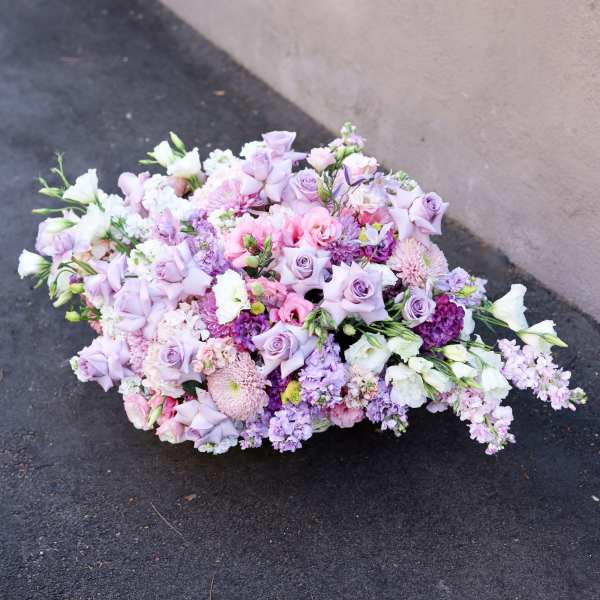 Large pastel bouquet of lavender, pink, and white flowers