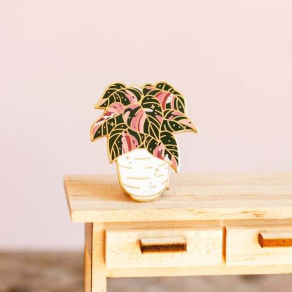 Decorative potted plant pin with pink and black leaves