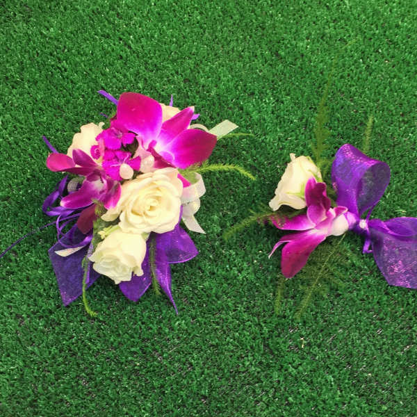 Purple orchid and white rose corsage with ribbon, plus a matching boutonniere
