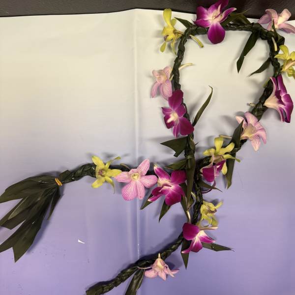 Braided floral garland with pink, purple, and yellow orchids