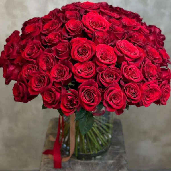 Large bouquet of red roses in a glass vase