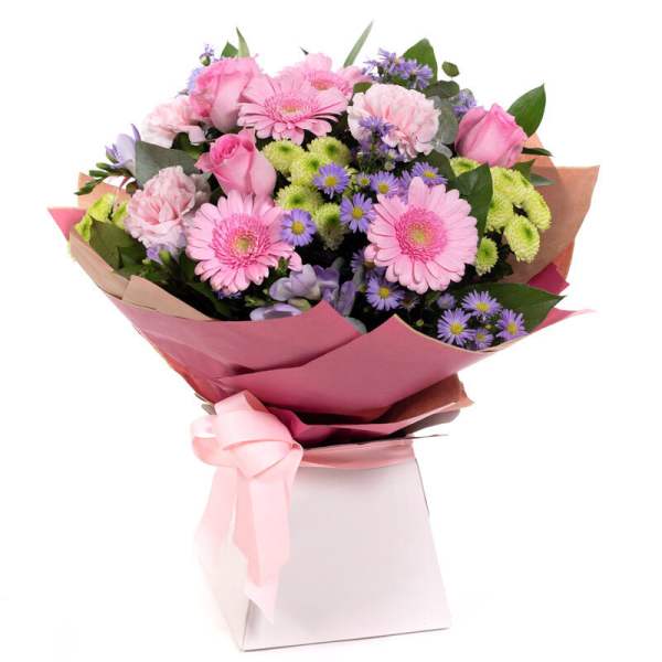 Pink and purple mixed bouquet wrapped in pink paper with a ribbon