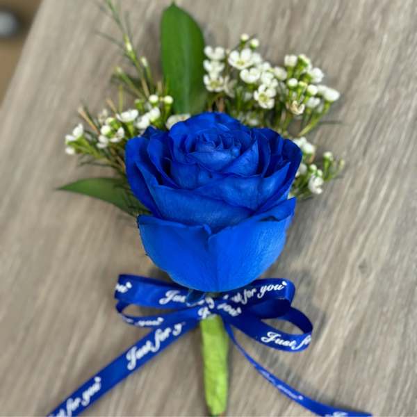 Single blue rose bouquet with white filler flowers and a blue ribbon