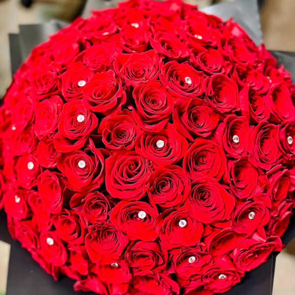 Round bouquet of red roses with small crystal accents