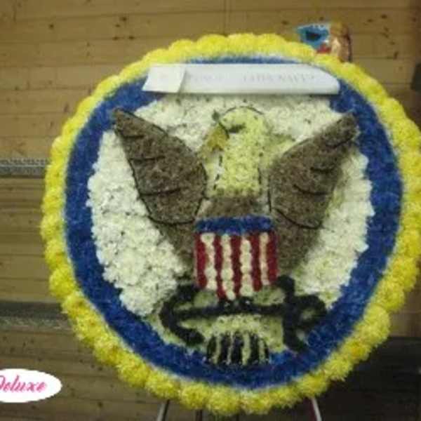 Circular floral tribute with an eagle and American flag design