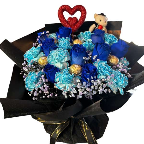 Blue roses and carnations bouquet with chocolates and a teddy bear