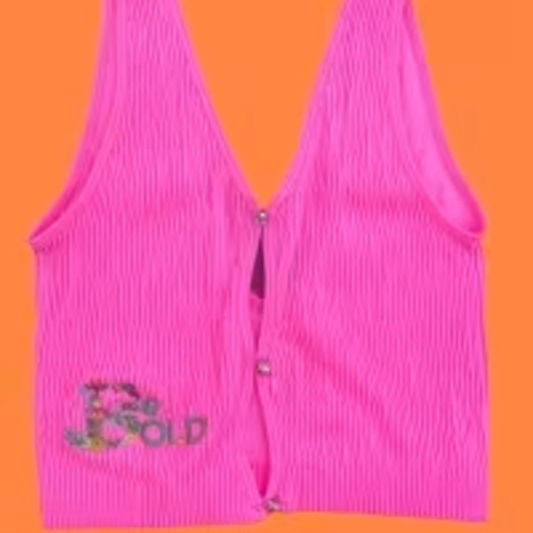 Bright pink pleated vest on an orange background