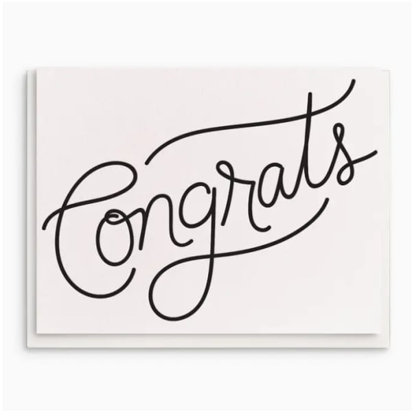 White card with the word "Congrats" in black script