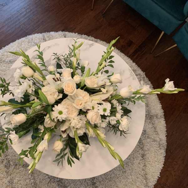 White floral arrangement on a round table