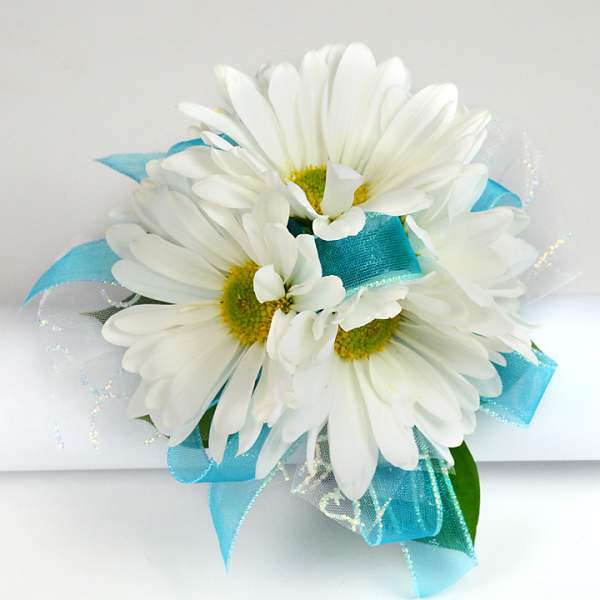 White daisy bouquet with bright blue ribbon accents