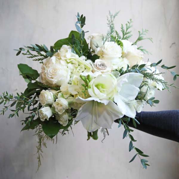White rose and calla lily bouquet with greenery