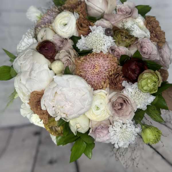 Round bouquet of blush, white, and brown flowers