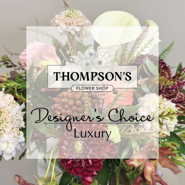 Mixed bouquet with pale pink, white, and burgundy flowers