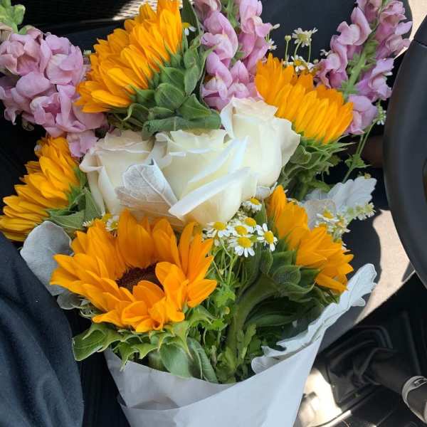Bouquet of sunflowers, white roses, and pink snapdragons