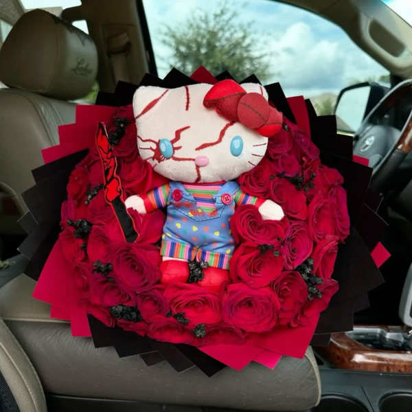 Hello Kitty plush surrounded by red roses in a bouquet