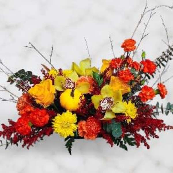 Bright mixed floral arrangement with yellow, orange, and red blooms