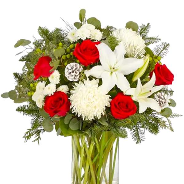 Red roses and white lilies in a clear glass vase