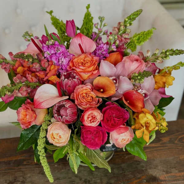 Colorful bouquet with roses, calla lilies, orchids, and snapdragons