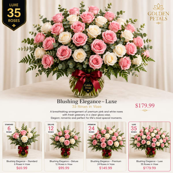 Pink and white roses arranged in a glass vase with a ribbon.