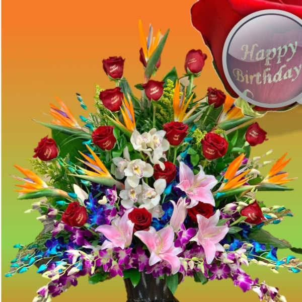 Large mixed bouquet with red roses, lilies, orchids, and bird-of-paradise in a black vase