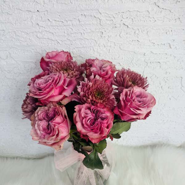 Pink rose bouquet with chrysanthemum blooms tied with a sheer ribbon