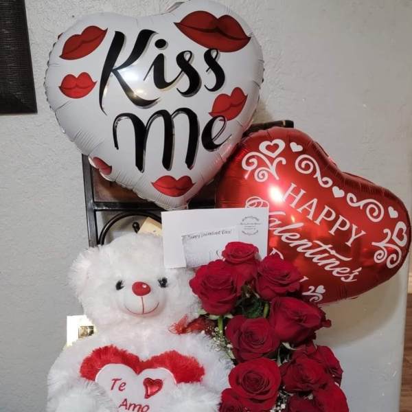 Heart balloons with roses and a teddy bear gift arrangement