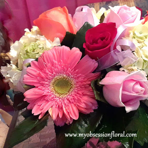 Pink and white bouquet with roses, gerbera daisy, and hydrangeas