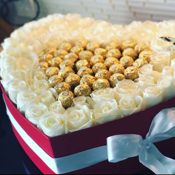 Heart-shaped box of white roses with gold-wrapped chocolates