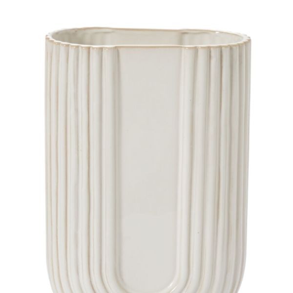 Cream ribbed ceramic vase with a rounded base
