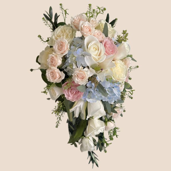 Cascade bouquet of pastel roses, hydrangeas, and white calla lilies