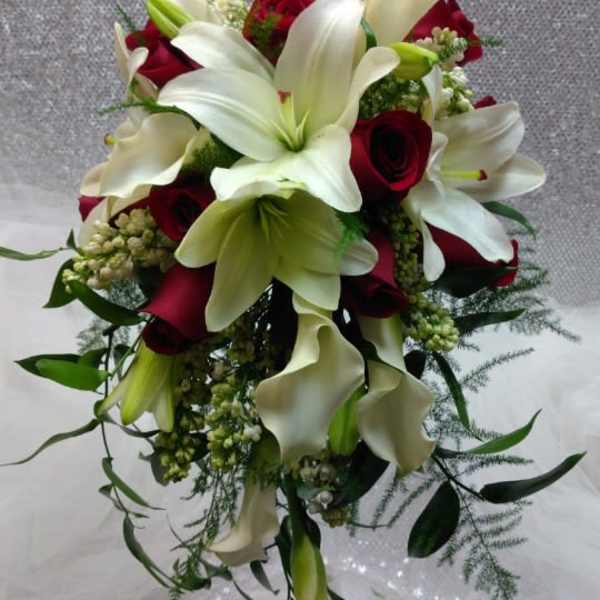 Bouquet of white lilies, red roses, and white calla lilies