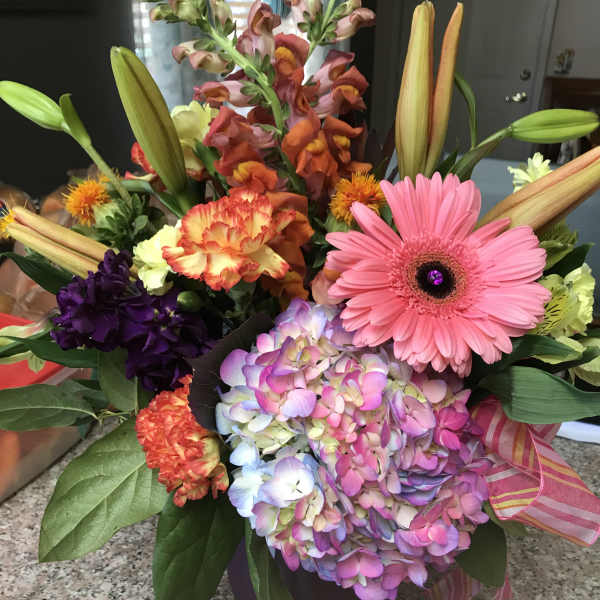 Colorful mixed bouquet with gerbera daisy, hydrangea, lilies, and snapdragons