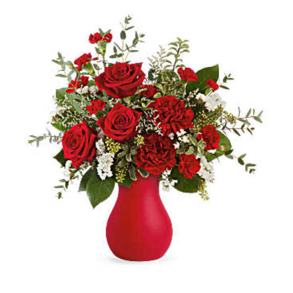 Red roses and carnations in a red vase
