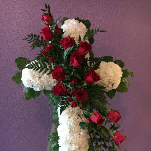 Standing floral cross with red roses and white carnations