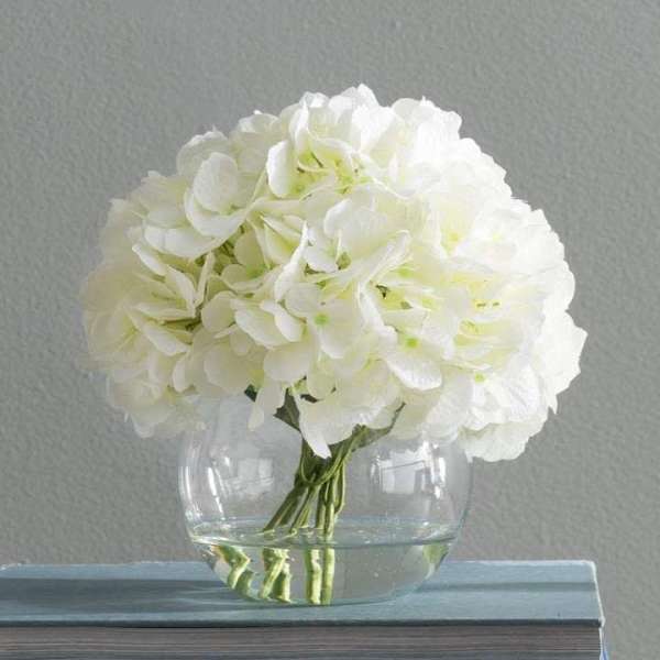 White hydrangea bouquet in a clear glass vase