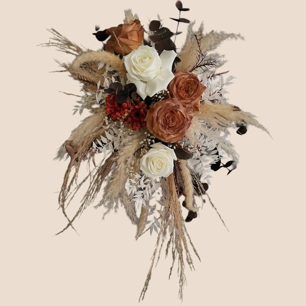 Dried floral bouquet with white and copper roses