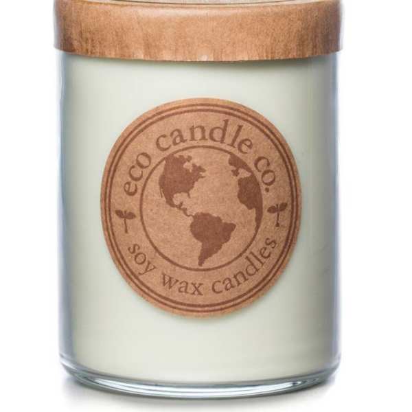 Soy wax candle in a glass jar with a wooden lid