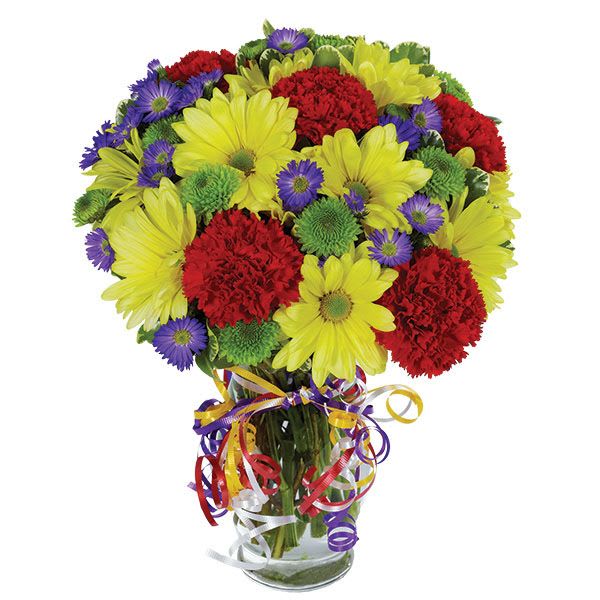 Bouquet of yellow daisies, red carnations, and purple asters in a glass vase